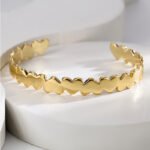 Wholesale European-style modern cuff bracelet featuring a minimalist design and 14K gold plated copper from junejewelry.com