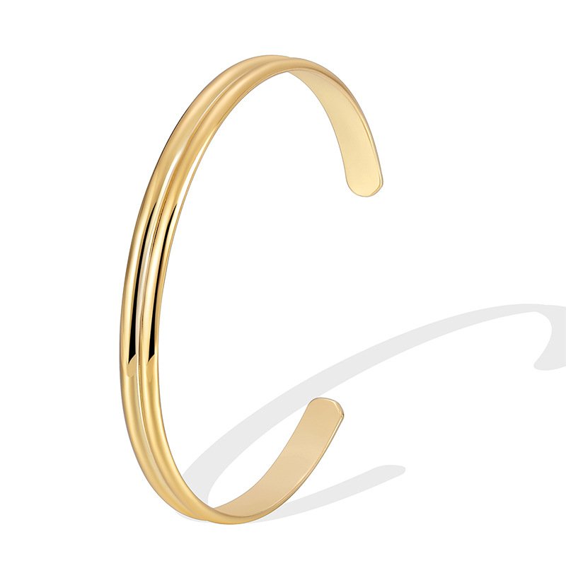 B0144 (1) Wholesale European-style minimalist U shape cuff bracelet featuring a 14k gold plated copper design from junejewelry.com