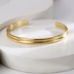 Wholesale European-style minimalist U shape cuff bracelet featuring a 14k gold plated copper design from junejewelry.com