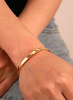 Wholesale European-style minimalist butterfly cuff bracelet featuring a 14k gold plated copper design from junejewelry.com