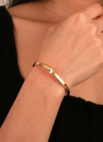 Wholesale European-style minimalist butterfly cuff bracelet featuring a 14k gold plated copper design from junejewelry.com