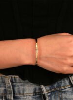 Wholesale European-style minimalist cross cuff bracelet featuring a 14k gold plated copper design from junejewelry.com