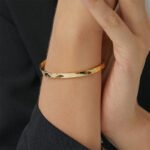 Wholesale European-style minimalist cuff bracelet featuring a 14k gold plated copper design from junejewelry.com