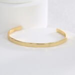 Wholesale European-style minimalist cuff bracelet featuring a 14k gold plated copper design from junejewelry.com