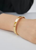 Wholesale European-style hammered cuff bracelet featuring a 14k gold plated copper design from junejewelry.com