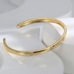 Buy wholesale triangle cuff bracelets. Simple, stylish, and adjustable, these 14K gold and platinum plated open cuff bracelets feature a modern triangle texture with CZ stone detailing. Free shipping at junejewelry.com.