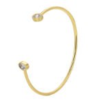 Wholesale European-style minimalist CZ cuff bracelet featuring a 14k gold plated copper design from junejewelry.com