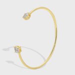 Buy Minimalist CZ cuff bangle. Simple, fashion, and adjustable, 14K gold plated open bangle feature a modern design . Free shipping at junejewelry.com.