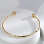 Buy Minimalist CZ cuff bangle. Simple, fashion, and adjustable, 14K gold plated open bangle feature a modern design . Free shipping at junejewelry.com.