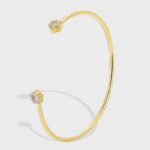 Buy Simple CZ Open Bracelet. wholesale fashion, and adjustable, 14K gold plated open bangle feature a modern design . Free shipping at junejewelry.com.