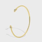 Wholesale Zircon Triangle Open Cuff Bracelet featuring a geometric triangle design with zircon stones on 14K gold-plated copper from junejewelry.com—factory price, free shipping.