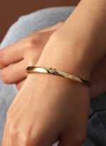 Wholesale Zircon Heart Cuff Bracelet featuring a micro‑pavé zircon heart on a 14K gold‑plated copper open cuff from junejewelry.com—factory price, free shipping.