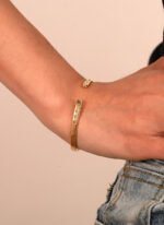 French Minimalist Gold Cuff featuring an open high‑polish 14K gold‑plated copper bracelet with a micro‑pavé zircon accent from junejewelry.com—factory price, free shipping.