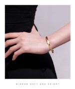 Wholesale European-style minimalist initial cuff bracelet featuring a 14k gold plated copper design from junejewelry.com