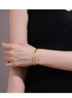 Wholesale European-style minimalist initial cuff bracelet featuring a 14k gold plated copper design from junejewelry.com