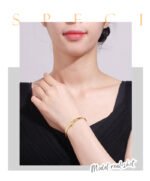 Wholesale European-style minimalist initial cuff bracelet featuring a 14k gold plated copper design from junejewelry.com