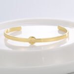 Wholesale European-style minimalist initial cuff bracelet featuring a 14k gold plated copper design from junejewelry.com