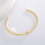 Wholesale European-style minimalist initial cuff bracelet featuring a 14k gold plated copper design from junejewelry.com
