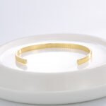 Wholesale European-style minimalist wishes cuff bracelet featuring a 14k gold plated copper design from junejewelry.com