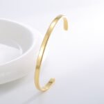 Wholesale European-style minimalist wishes cuff bracelet featuring a 14k gold plated copper design from junejewelry.com