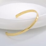 Wholesale European-style minimalist wishes cuff bracelet featuring a 14k gold plated copper design from junejewelry.com