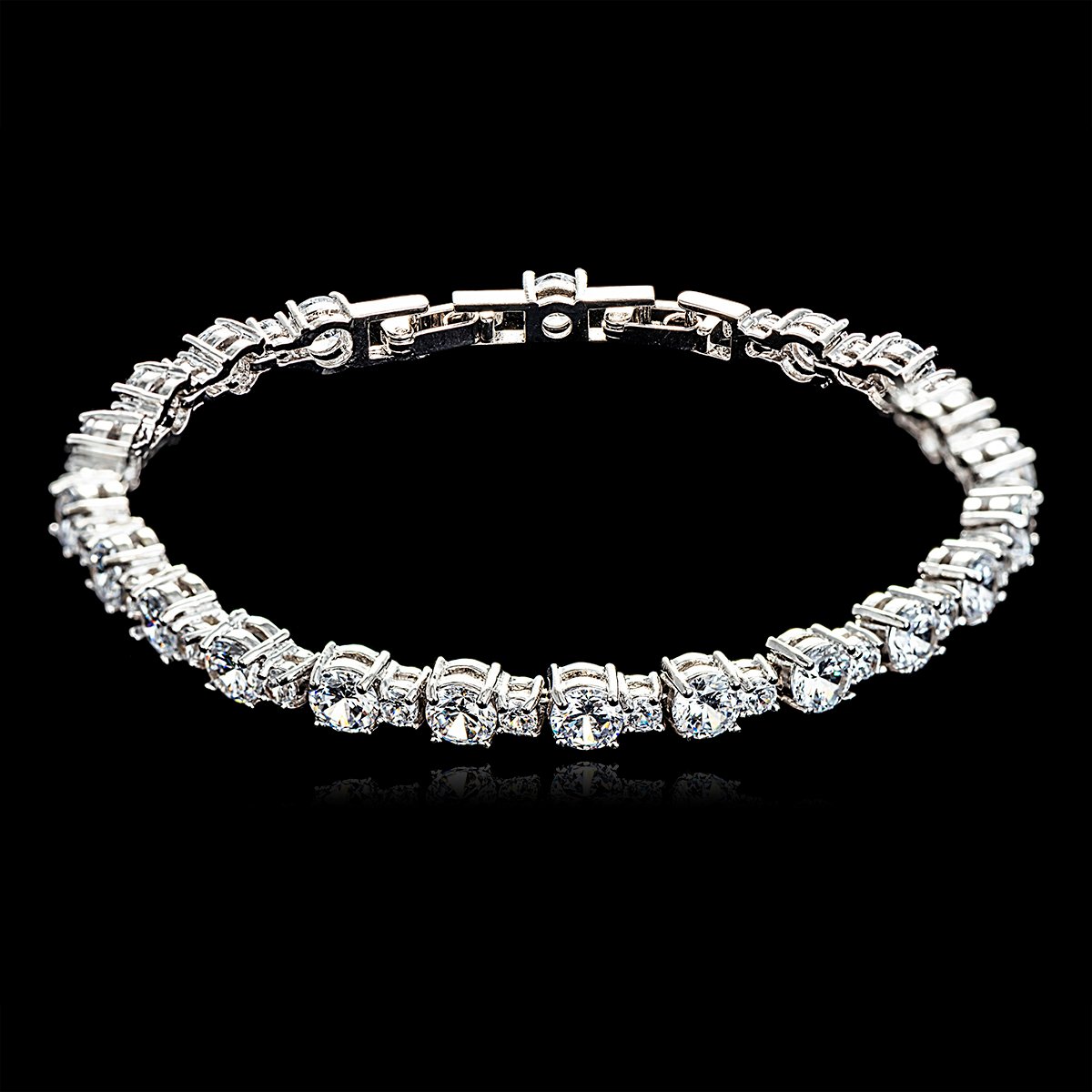 CK10060-001.140.A Classic cubic zirconia tennis bracelet with platinum plating on a black background.