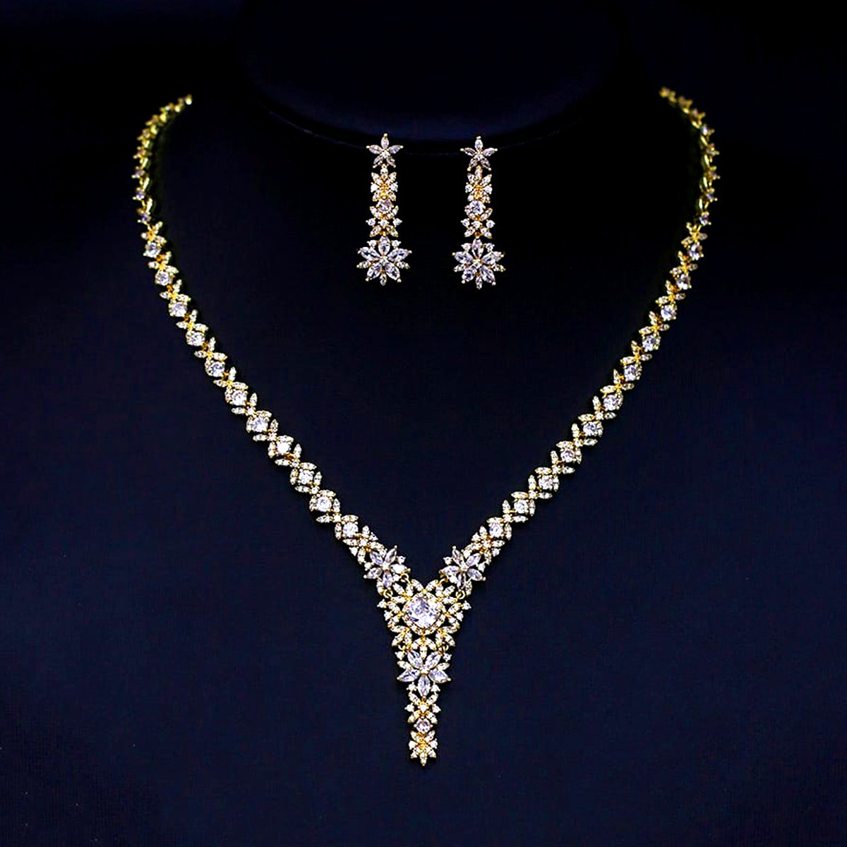 CN10390.473.A Wholesale flower cubic zirconia wedding jewelry set with 18K gold-plated copper necklace and matching earrings, from JuneJewelry.com.