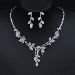 Wholesale leaf cubic zirconia wedding jewelry set with platinum-plated copper necklace and matching earrings, available in clear, green, and red from JuneJewelry.com.