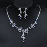 Wholesale leaf cubic zirconia wedding jewelry set with platinum-plated copper necklace and matching earrings, available in clear, green, and red from JuneJewelry.com.