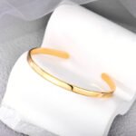 Wholesale European-style minimalist open cuff bracelet featuring a 14k gold plated copper design from junejewelry.com