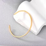 Wholesale European-style minimalist open cuff bracelet featuring a 14k gold plated copper design from junejewelry.com