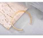 Wholesale European-style minimalist open cuff bracelet featuring a 14k gold plated copper design from junejewelry.com