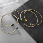 Wholesale European-style minimalist gemstone cuff bracelet featuring a 14k gold plated copper design from junejewelry.com