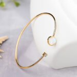 Wholesale European-style minimalist gemstone cuff bracelet featuring a 14k gold plated copper design from junejewelry.com