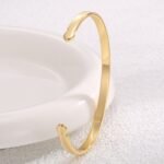 Wholesale European-style minimalist arrow cuff bracelet featuring a 14k gold plated copper design from junejewelry.com