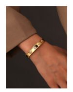 Four Leaf Clover Cuff Bracelet featuring a hollow shamrock motif with micro‑pavé zircon stones on 14K gold‑plated copper from junejewelry.com—factory price, free shipping.