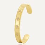 Four Leaf Clover Cuff Bracelet featuring a hollow shamrock motif with micro‑pavé zircon stones on 14K gold‑plated copper from junejewelry.com—factory price, free shipping.