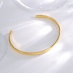 Wholesale European-style minimalist patterned cuff bracelet featuring a 14k gold plated copper design from junejewelry.com