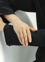 Wholesale Pearl Zircon Ring with adjustable open design, ladder-set zircon, and synthetic pearl on 18K gold-plated brass band from junejewelry.com.