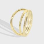 Wholesale Triple Layer Ring in 18K gold-plated brass with minimalist stacked design from junejewelry.com — INS retro cold style, bulk jewelry.