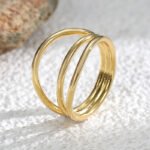 Wholesale Triple Layer Ring in 18K gold-plated brass with minimalist stacked design from junejewelry.com — INS retro cold style, bulk jewelry.