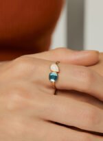 Wholesale geometric opal CZ ring featuring an 18k gold plated copper design from junejewelry.com