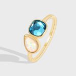Wholesale geometric opal CZ ring featuring an 18k gold plated copper design from junejewelry.com