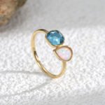 Wholesale geometric opal CZ ring featuring an 18k gold plated copper design from junejewelry.com