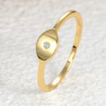 Wholesale European-style minimalist Evil Eye ring featuring an 18k gold plated copper design from junejewelry.com