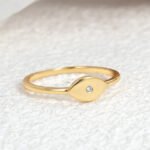 Wholesale European-style minimalist Evil Eye ring featuring an 18k gold plated copper design from junejewelry.com