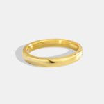 Wholesale Gold Band Ring in minimalist round arc design, real gold plated brass with high-polish finish, sizes 6-9, from junejewelry.com.