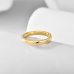 Wholesale Gold Band Ring in minimalist round arc design, real gold plated brass with high-polish finish, sizes 6-9, from junejewelry.com.