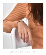 Wholesale 3 stone ring featuring a classic design with 18K gold plated copper and CZ stones from junejewelry.com