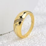 Wholesale Croissant Dome Ring in 18K gold-plated brass with glossy wide-band design, available in sizes 6 to 9 from junejewelry.com.